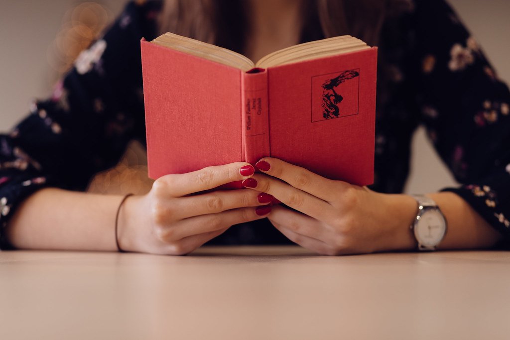 Student reading a book while preparing for IELTS - IELTS coaching in Hyderabad