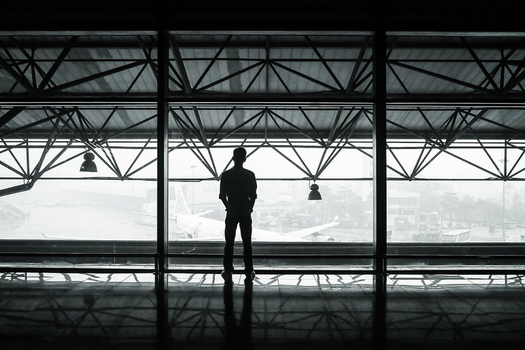 Traveller at an airport terminal - visa consultants in Hyderabad